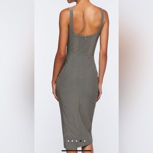 A woven midi dress featuring a mesh lace up corset bodice